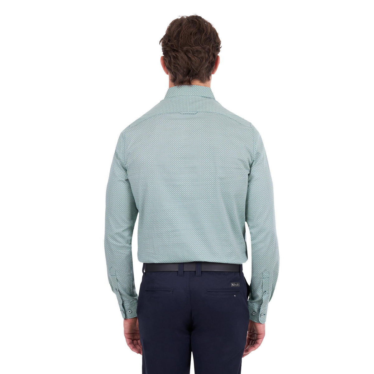 A man viewed from the back wearing a light sage green long-sleeve dress shirt with a subtle micro-pattern, paired with navy trousers and a black belt, against a plain white background.