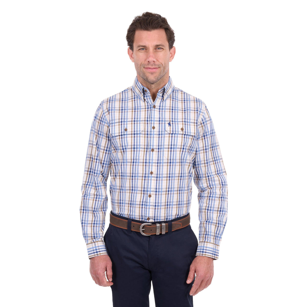 A man wearing a long-sleeve button-down plaid shirt with blue, white, and tan stripes, paired with dark navy pants and a brown belt, photographed against a solid white background.