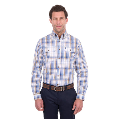 A man wearing a long-sleeve button-down plaid shirt with blue, white, and tan stripes, paired with dark navy pants and a brown belt, photographed against a solid white background.