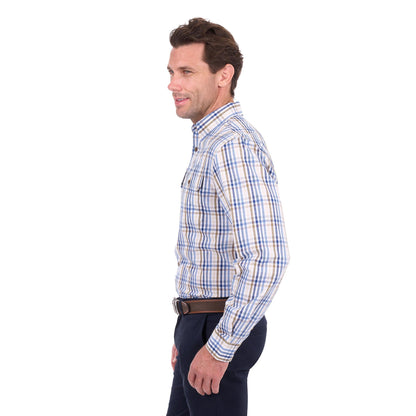 A man shown in profile wearing a long-sleeve button-down plaid shirt with blue, white, and tan stripes, paired with dark trousers and a brown belt, against a plain white background.