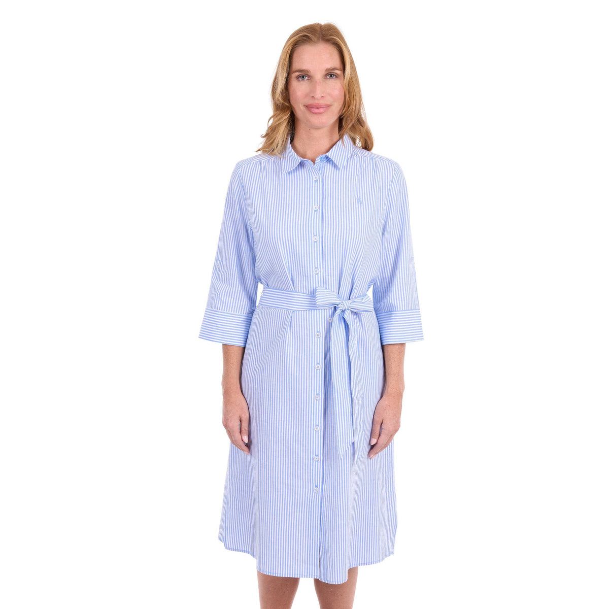 A woman modeling a light blue and white vertically striped shirt dress with a tie waist and three-quarter sleeves, set against a plain white background.